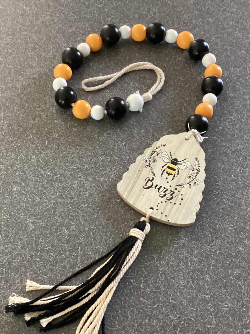 Wood beaded bumblebee hanging outside/inside ornament. 26” long. Yellow, black